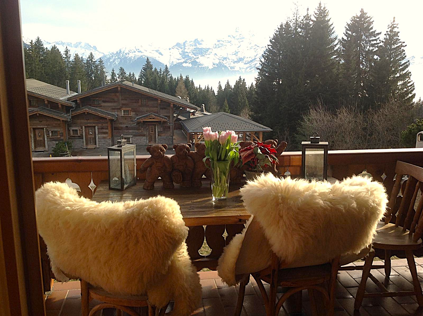 Very comfortable terrace with wood seats and a breathtaking view over the mountains