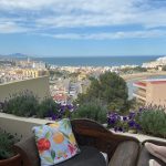 beautiful view to the sea from the terrace with antique wood seat